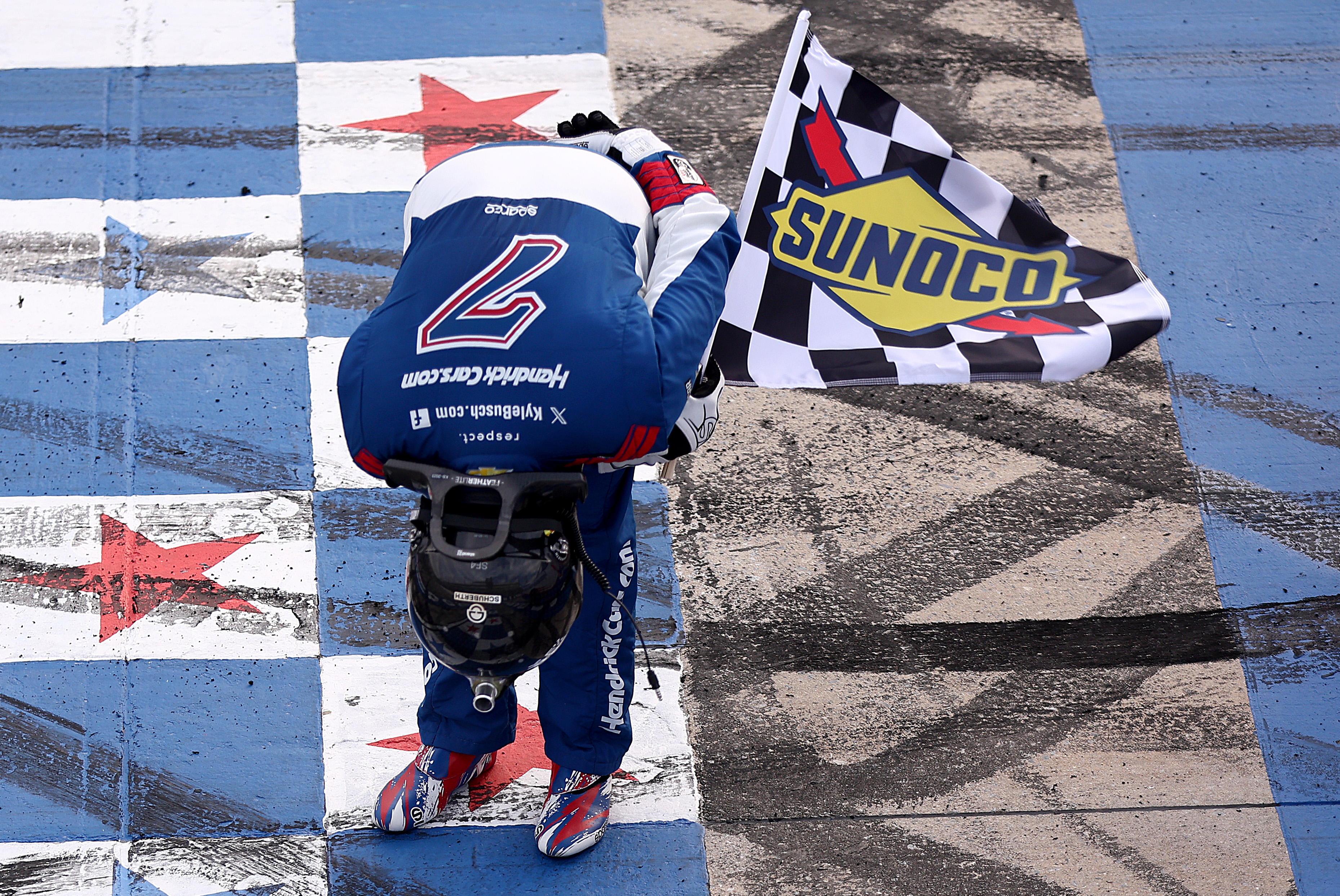 Kyle Busch bows to fans at Dover Motor Speedway after his win, May 15, 2026.