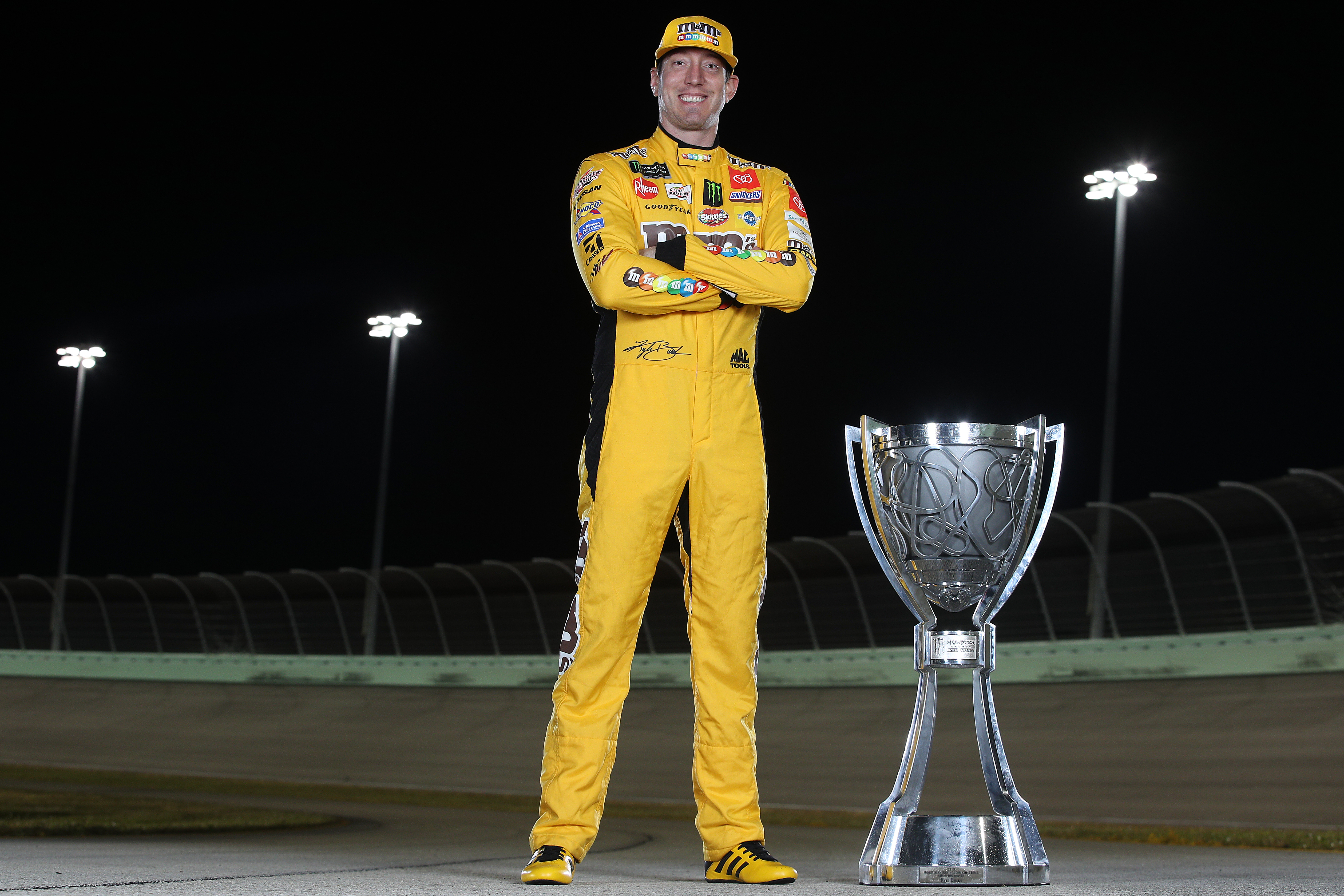 Kyle Busch with the 2019 Cup Series championship trophy.