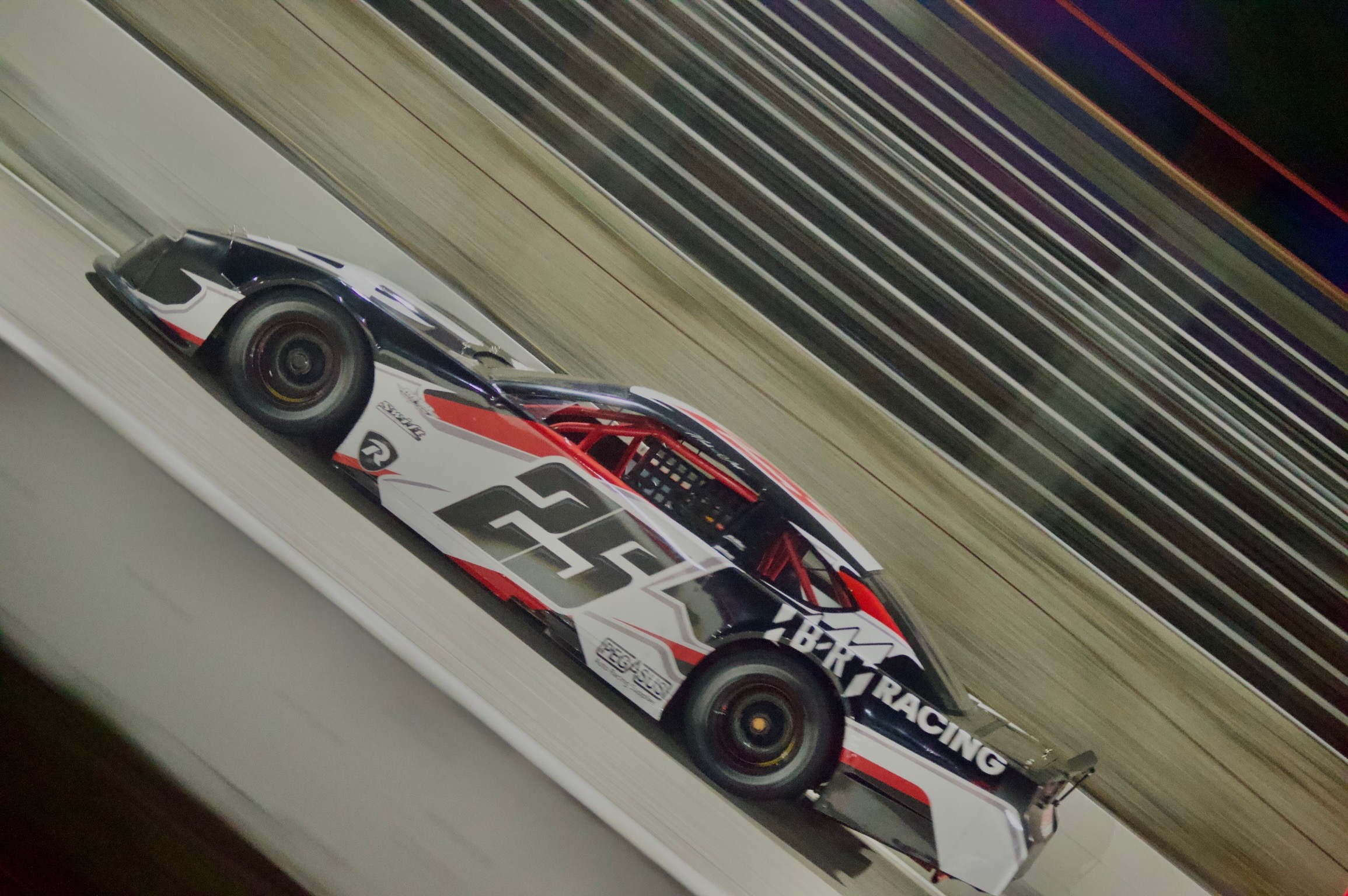 The No. 25 Queen City Garage Limited Late Model in B/R Racing livery — side profile in motion at Florence Motor Speedway, May 9, 2026.
