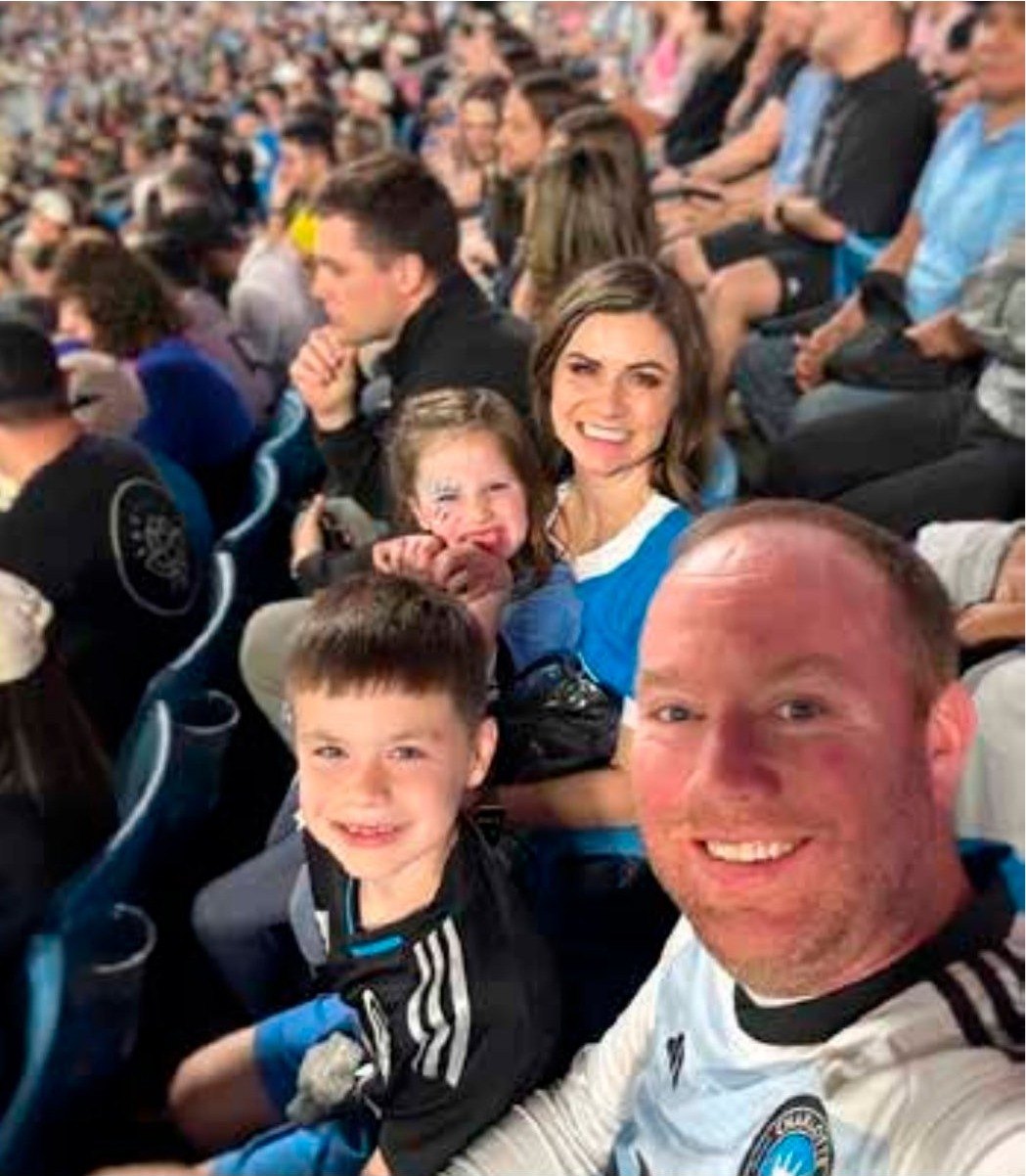 The Galbraith family in the stands at a game
