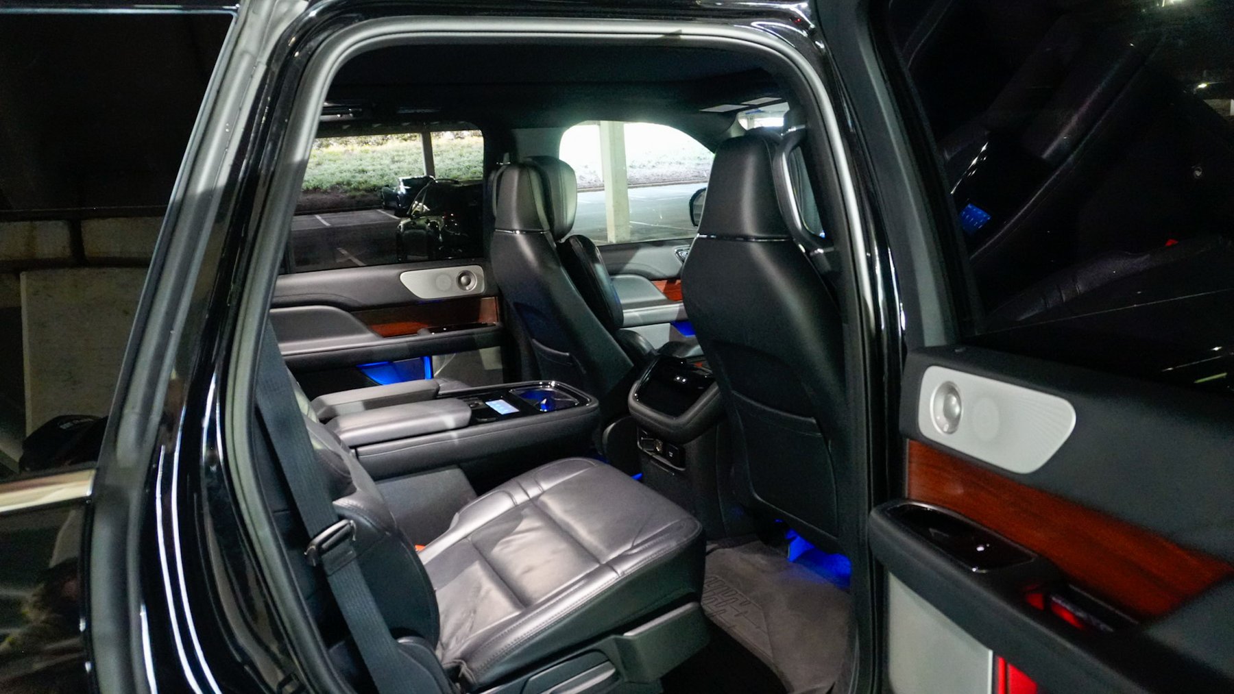 Black leather captain's chairs inside the SUV