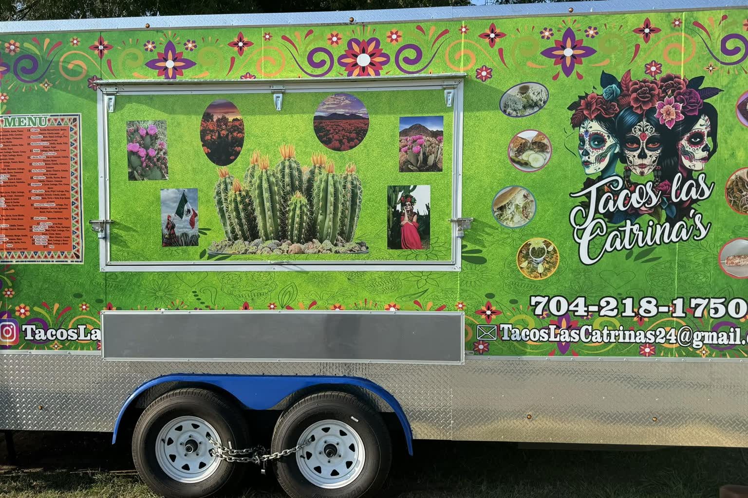 The Tacos Las Catrina's birria taco truck, wrapped in lime green with Day of the Dead artwork and a painted menu board